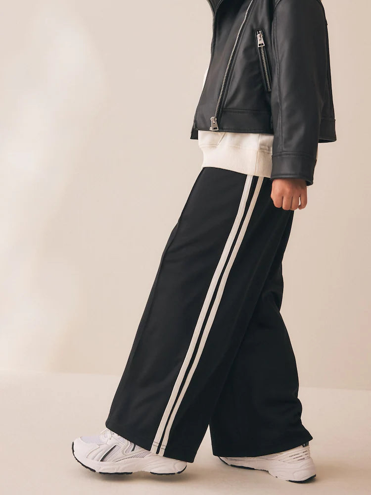 Pantaloni cu croială largă și dungă laterală – negri, fete, 3 ani - 14 ani, NEXT