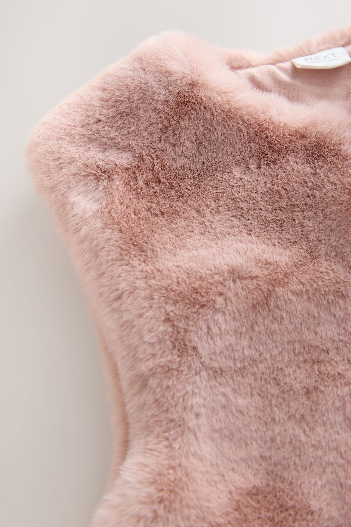 Vestă din faux fur – roz, fete, 3-6 luni - 6-7 ani, NEXT
