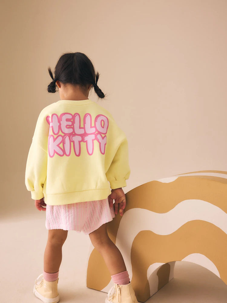 Set Hello Kitty cu bluză de trening și pantaloni scurți - galben